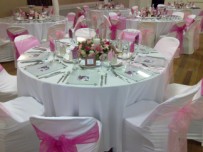 Guest table setting in pink, glass underplates with photo, German hall Philippi